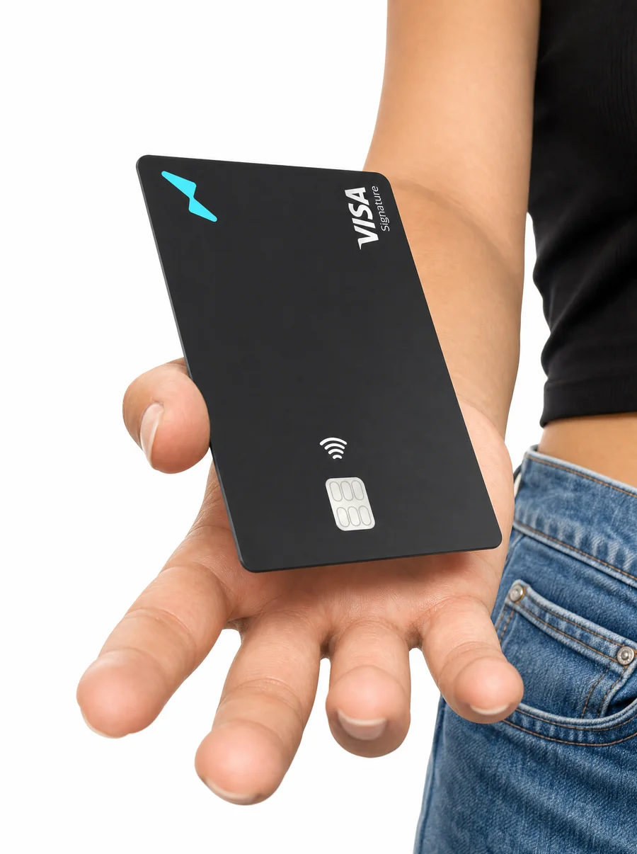 A black Offramp corporate Visa Signature card held in hand